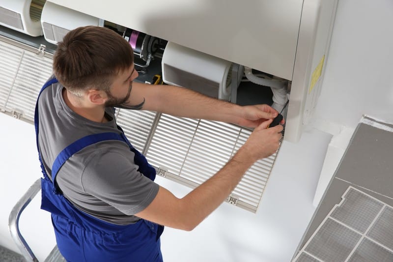 Young,Male,Technician,Repairing,Air,Conditioner,Indoors